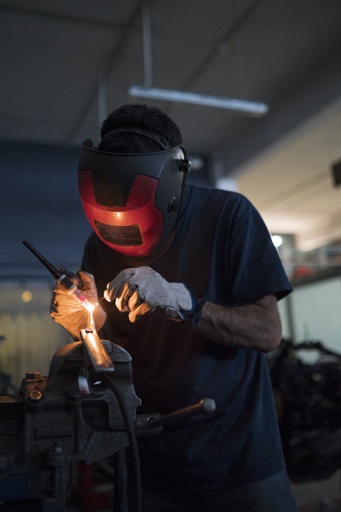 Mechanic in a repair garage welding
